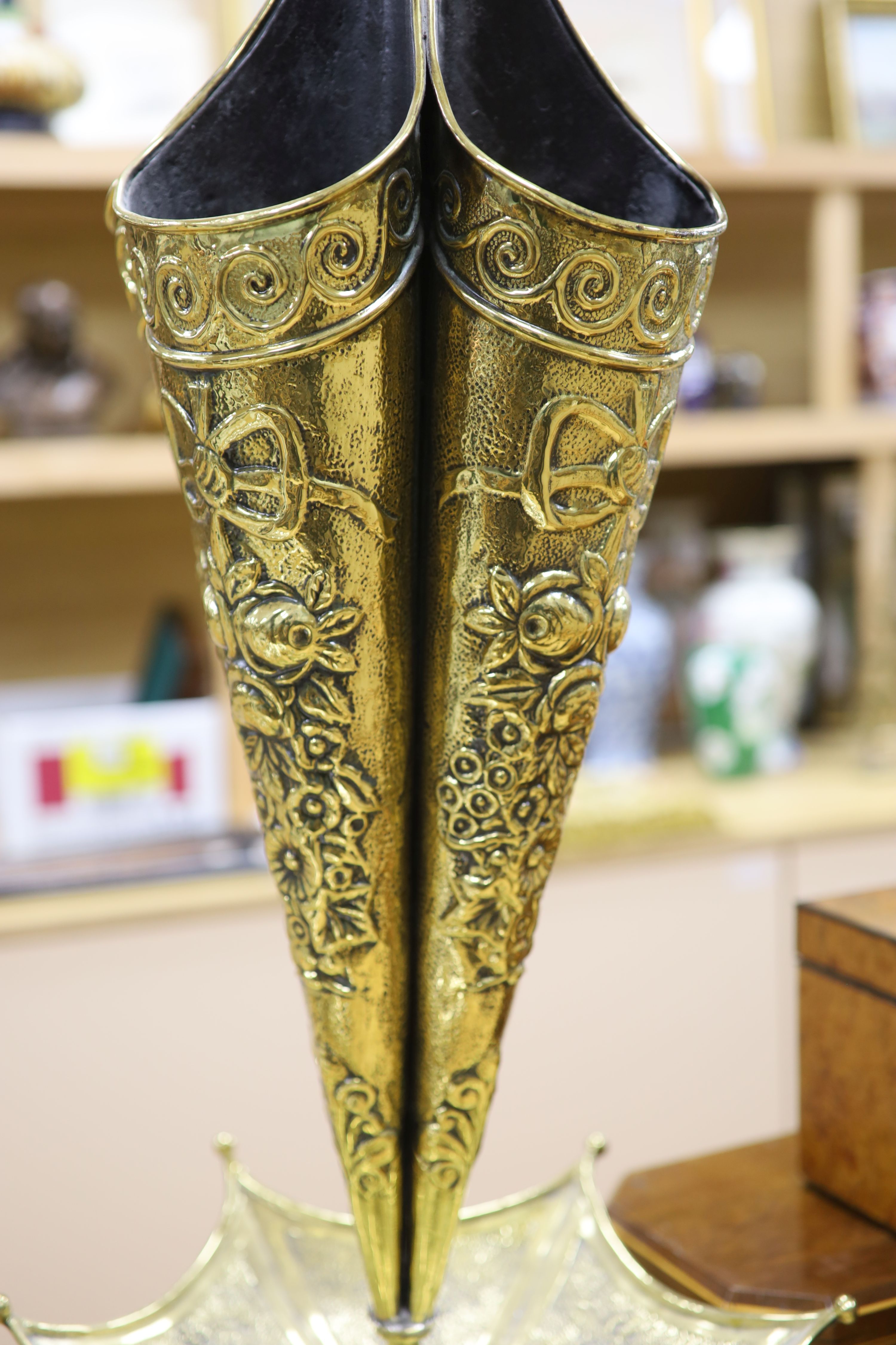 A Dutch brass embossed parasol shaped stick stand, height 91cm